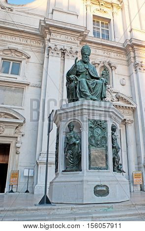 LORETO ITALY - OCTOBER 6 2012: The bronze statue of the Pope Sixtus V at the entrance to Sanctuary of Santa Casa on October 6 in Loreto.