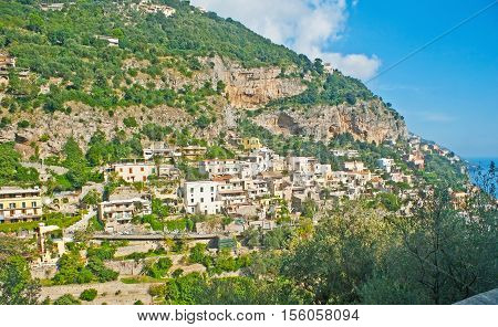The scenic landscape of Amalfi Coast with green forests on the rocky slopes of Lattari Mountains Positano Italy.
