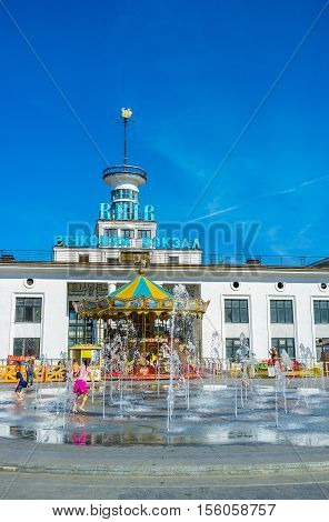 KIEV UKRAINE - SEPTEMBER 8 2016: The fountain in Postal (Poshtova) Square with the River Port on the background on September 8 in Kiev.
