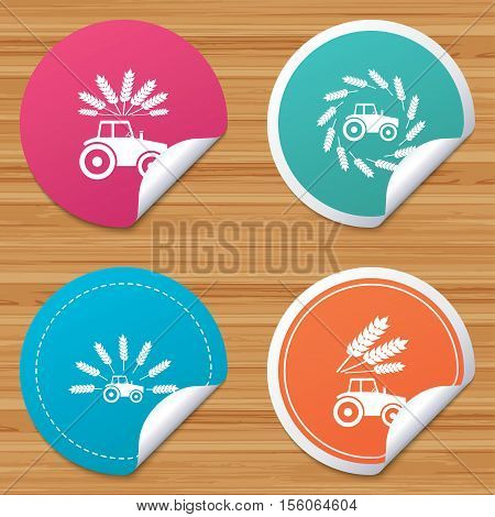 Round stickers or website banners. Tractor icons. Wreath of Wheat corn signs. Agricultural industry transport symbols. Circle badges with bended corner. Vector