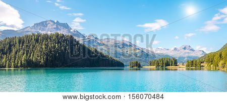 Great view of the azure pond Champfer in alpine valley. Popular tourist attraction. Picturesque and gorgeous scene. Location Swiss alps, Silvaplana village, district of Maloja, Europe. Beauty world.