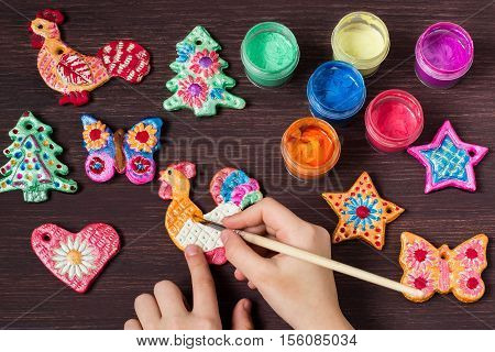 Making toys for Christmas decorations from salt dough with your own hands. Children's art project. DIY concept. Step by step photo instructions. Step 7. Painting toys