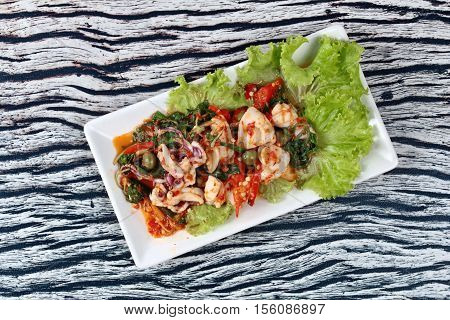 Fried Spicy Mixed Herb  With Squid And Spicy Sour Filling.