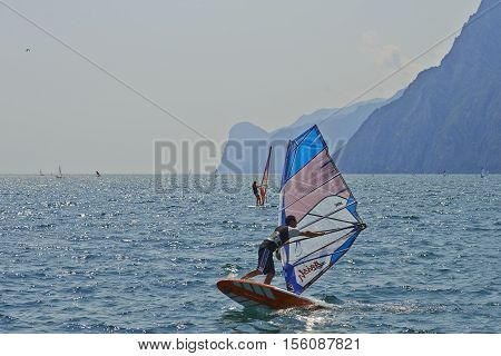 Torbole - Nago, Lago di Garda (Lago Benaco), Italy - August 11, 2015: A windsurfing on Lake Garda in Torbole resort.