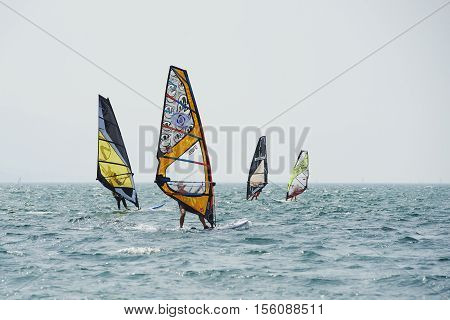 Torbole - Nago, Lago di Garda (Lago Benaco), Italy - August 11, 2015: A windsurfing on Lake Garda in Torbole resort.