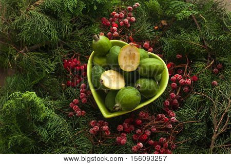 Feijoa source of iodine and vitamins for a healthy diet. Bowl full of feijoa, exotic fruit.