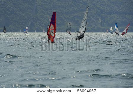 Torbole - Nago, Lago di Garda (Lago Benaco), Italy - August 11, 2015: A windsurfing on Lake Garda in Torbole resort.