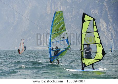 Torbole - Nago, Lago di Garda (Lago Benaco), Italy - August 11, 2015: A windsurfing on Lake Garda in Torbole resort.
