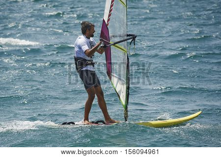 Torbole - Nago, Lago di Garda (Lago Benaco), Italy - August 11, 2015: A windsurfing on Lake Garda in Torbole resort.
