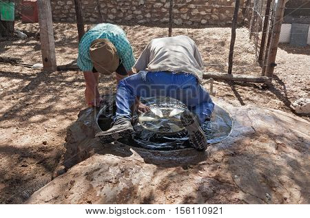 FARM HEIMAT, NAMIBIA-NOVEMBER 20, 2015: Inspection after repair of a leaking car tire