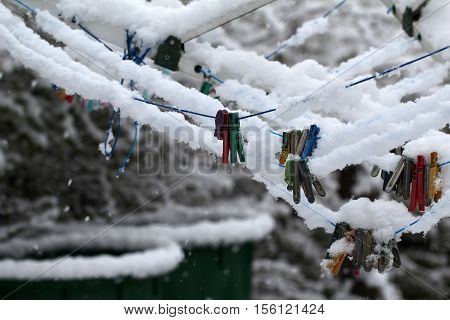 Close up of a colored clothespins on a clothesline