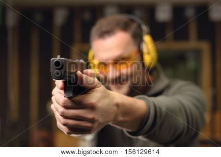 Sport shooting range. The man at the shooting range.