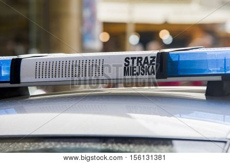 Close up on Straz Miejska (Municipal Police) sign on car