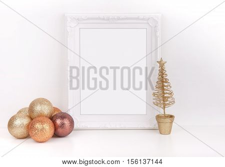 Christmas mockup styled stock photography with white ornate frame and gold glitter baubles with a gold christmas tree add quote promotion headline or design lifestyle bloggers and social media campaigns