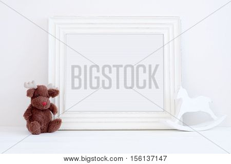 Christmas styled mockup portrait frame toy reindeer and rocking horse overlay your business message promotion headline or design great for lifestyle bloggers and social media campaigns