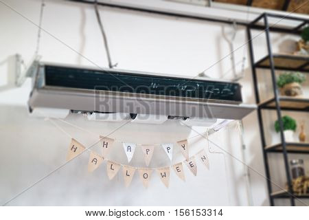 Hanging air conditioner and Halloween flags stock photo