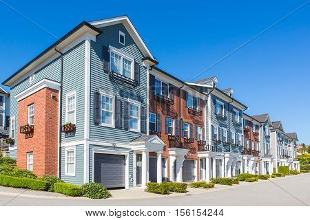 Row of townhouses on a sunny day