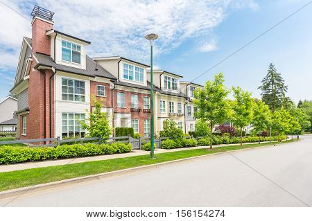 Row of townhouses on a sunny day