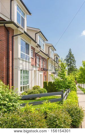 Row of townhouses on a sunny day