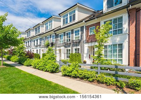 Custom built house in the nice neighbourhood on a sunny day.