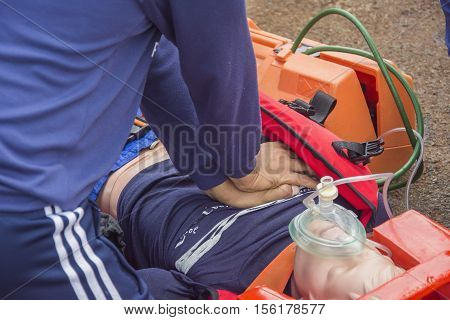cpr dummy victim drowning on oxygen cylinder mank with bag