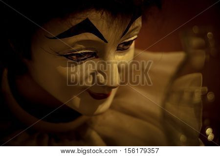 Bozo Doll Hold Quill Pen And Light Of Lamp