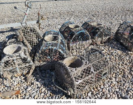 Lobster pots on Beer beach Devon England UK