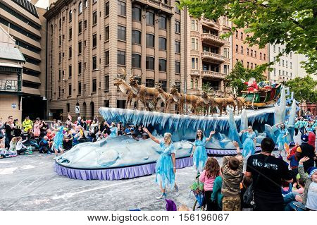 Adelaide South Australia - November 12 2016: More than 250.000 came to the city centre to see 172 colourful sets of floats bands dancers clowns and Father Christmas. The Credit Union Christmas Pageant is one of the biggest events in South Australia