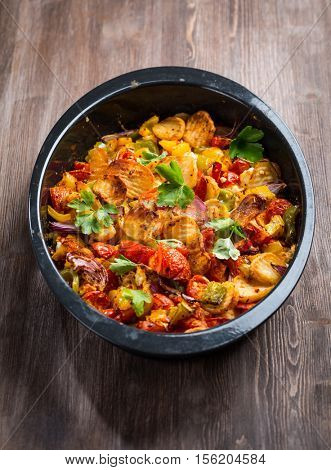 Baked vegetables in pan with herbs
