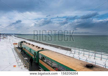 Ryuho Norokko Train Stop At Station Along Beach