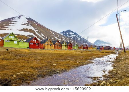 Colorful wooden houses at Longyearbyen in Svalbard. Summer in the arctic environment of Longyearcity