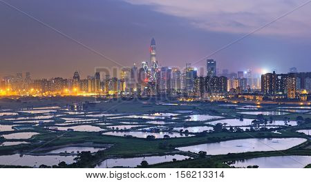 Shenzhen citscape at night , view from hiong kong countryside