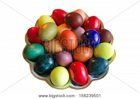 Rustic Easter colored eggs in the dish on white background