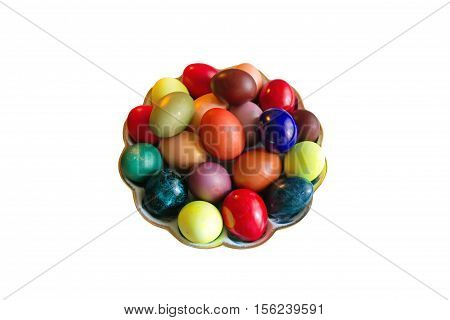 Rustic Easter colored eggs in the dish on white background