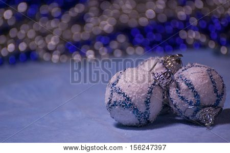 Three Christmas tree balls and a magical flare of beads.