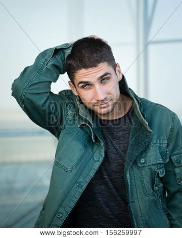 Portrait of a man with pale blue eyes. Men Health. Street fashion. Eyes like a Husky. Piercing eyes.