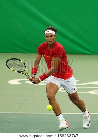 RIO DE JANEIRO, BRAZIL - AUGUST 7, 2016: Olympic champion Rafael Nadal of Spain in action during men's singles first round match of the Rio 2016 Olympic Games at the Olympic Tennis Centre