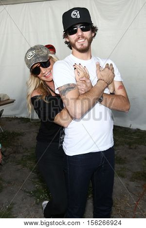 LAKE WALES, FL-NOV 4: Kelly Janson (L) and Chris Janson at the CountryFlo Music and Camping Festival on November 4, 2016 in Lake Wales, Florida.