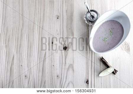 Chestnut soup with milk and cinnamon on white board