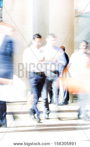 Business people blur. People walking in the City of London, business and financial aria