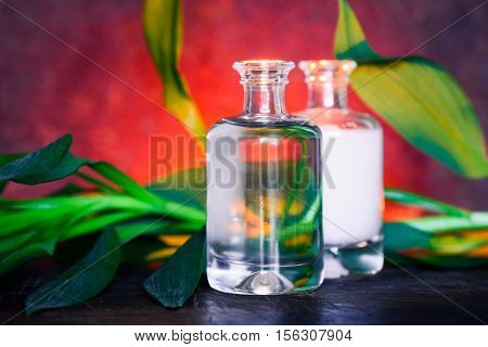 Organic cosmetic products concept spa setting with two bottles of natural cosmetics such as massage or essential oil and lotion