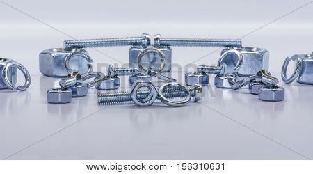 Some bolts and nuts on white background