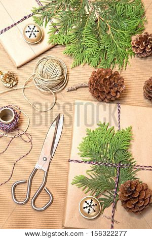 Wrapping Christmas presents with the cypress branches