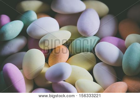 Sweet coloured almond candies in different colours
