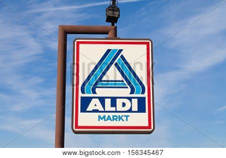 BURG / GERMANY - NOVEMBER 13 2016: Aldi sign against blue sky. Aldi is a leading global discount supermarket chain with almost 10000 stores in 18 countries.