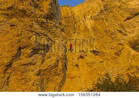 Rock climber on a steep rock. Cape Alchak Crimea.