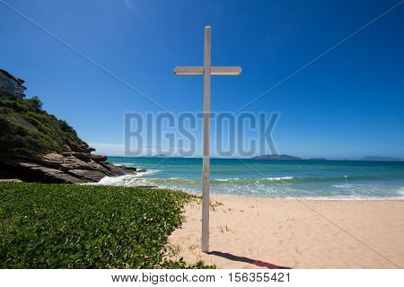 Cross on the beach Buzios Brazil Caravelas