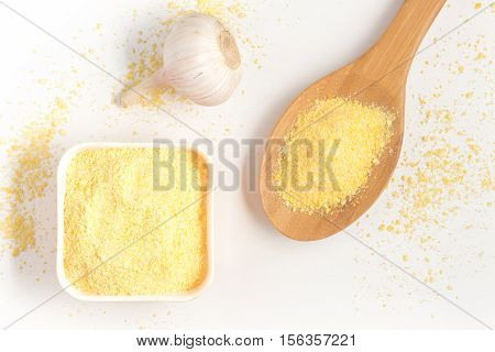 Corn Couscous into a bowl isolated on white background. Cuscus
