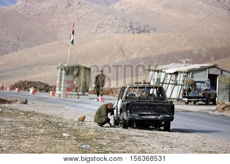 SULEIMANIE, IRAQ - DECEMBER 30 : Unidentified Iraqi soldiers stand guard at a check point on December 30, 2007 in Suleimanie, Iraq.