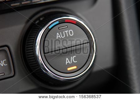 manual switches the air conditioning on the dashboard of the car